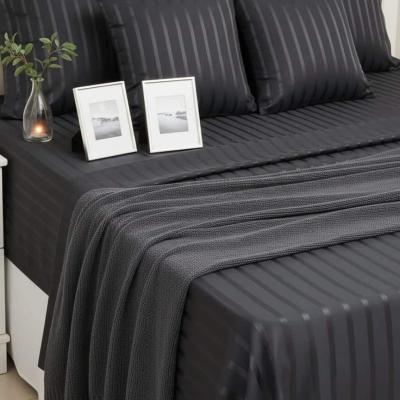 20 كرتونه × طقم ملاية استرايب اسود قطع